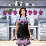 Tablier Parties scintillant rose noir monogramme nom initi<br><div class="desc">Un arrière - plan noir,  décoré de poussière de parties scintillant rose imitation. Personnalisez et ajoutez vos initiales et votre nom de monogramme. Lettres en bloc modernes.</div>