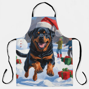 Tablier Rottweiler courant dans la neige avec un chapeau d