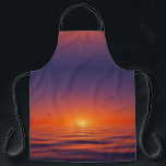 Tablier Sunset Horizon Apron<br><div class="desc">This apron features a serene sunset design with a gradient sky shifting from deep purple to glowing orange at the horizon. The sun casts a warm light over calm ocean waves, while birds soar gracefully across the sky, adding movement to the tranquil scene. Combining vivid colors with peaceful imagery, this...</div>