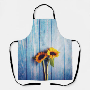 Tablier Tournesol sur Mur en Bois Bleu