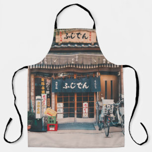 TABLIER TROIS BICYCLETTES PARKÉES DEVANT L'ÉDIFICE