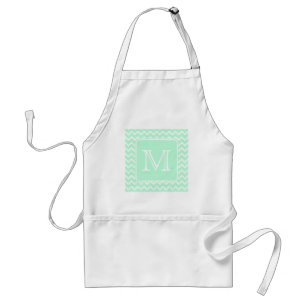Tablier Zigzag vert en bon état avec le monogramme fait