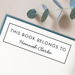 Tampon Auto-encreur Ce Livre Appartient À | Plaque d'enregistrement de<br><div class="desc">Simple et élégante coutume "This Book Belongs To" design dans une typographie minimaliste moderne et simple bordure noire simple. Le nom,  en typographie manuscrite,  peut facilement être personnalisé avec votre propre nom! Un cadeau ou un accessoire parfait pour un amateur de livres ou un enseignant!</div>