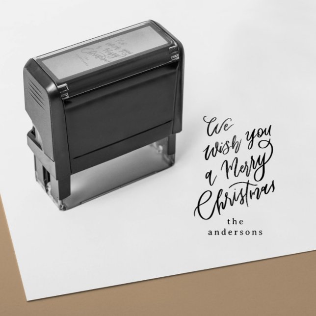 Tampon Auto-encreur Nous vous souhaitons un joyeux cadeau de Noël (self inking stamp with a hand lettering Merry Christmas message and custom family name)