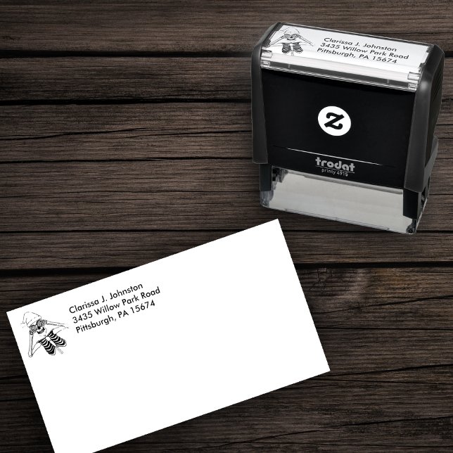 Tampon Auto-encreur Silencieux Squelette Ornement de Noël Yeux Santa C (Line drawing of christmas fun skeleton  wearing Santa hat on self inking return address stamp.)
