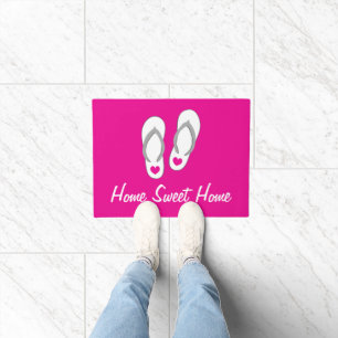 Tapis de porte rose avec design de tongs de plage