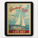 Tapis De Souris Vintage voyage de voilier du Cap May New Jersey<br><div class="desc">Ce Salutations From Cape May New Jersey design nautique de voyage vintage comprend un bateau naviguant sur l'eau avec des mouettes et un ciel bleu rempli de somptueux nuages blancs bouffants.</div>