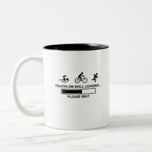 TASSE 2 COULEURS CHARGEMENT DES COMPÉTENCES DE TRIATHLON