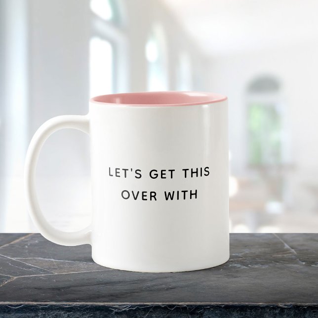 Tasse 2 Couleurs Finissons-en avec une citation drôle et tendance (A white mug with a pink interior sits on a dark marble surface. text reads "LET'S GET THIS OVER WITH)