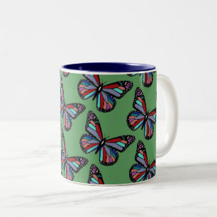 Tasse 2 Couleurs Papillons colorés assez ornés sur fond vert