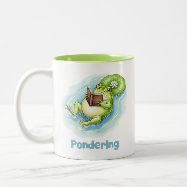 Tasse 2 Couleurs Pondering Frog Reading Book  (Gauche)