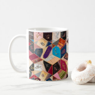 Tasse antique de motif d'édredon