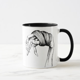 Tasse attachée de mains