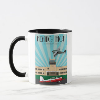 Tasse d'art déco avec l'aéroport et la tamia de