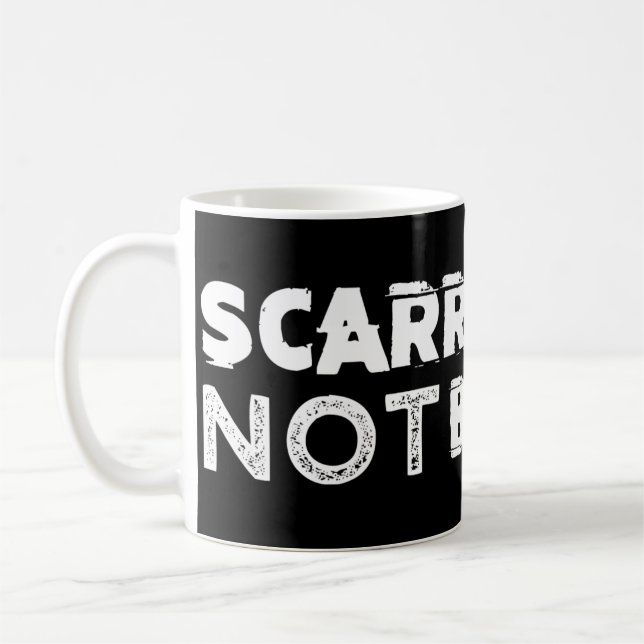 Tasse de café noir marquée mais non cassée (Gauche)