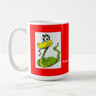 Tasse de café verte et jaune de serpent