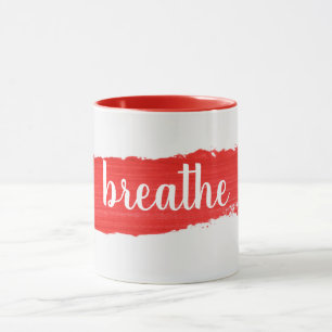 Tasse de peinture rouge avec texte RESPIRE