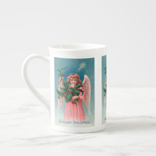 Tasse de thé vintage d'ange de rose de Noël
