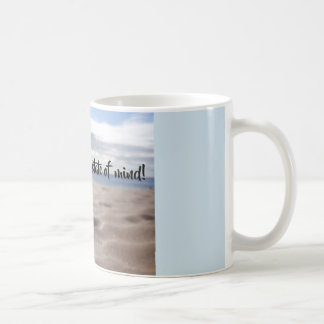 Tasse d'état d'esprit de bascule avec le sable de