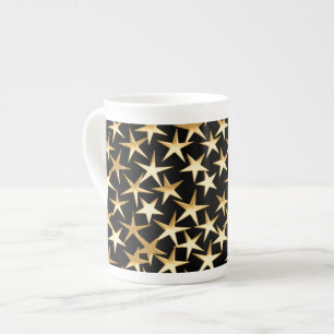 Tasse En Porcelaine étoiles d'or sur un arrière - plan noir
