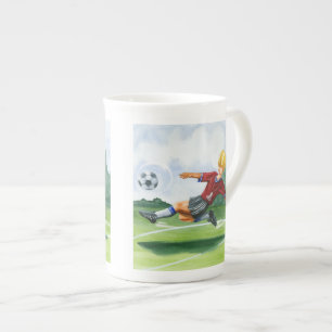 Tasse En Porcelaine Footballeur donnant un coup de pied une boule par