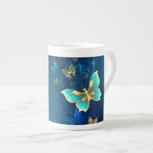 Tasse En Porcelaine Papillons d'or sur un Arrière - plan bleu