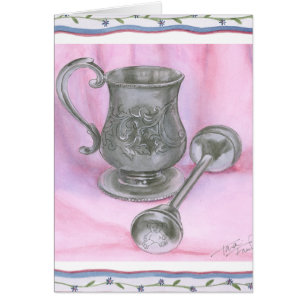 Tasse et hochet d'héritage sur l'arrière - plan
