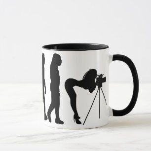 Tasse femelle d'évolution de photographe