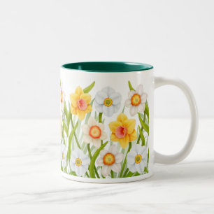 Tasse gaie de jonquilles de ressort