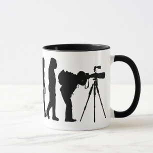 Tasse masculine d'évolution de photographe