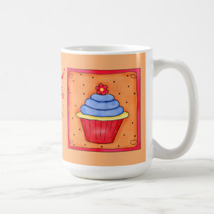 Tasse orange et bleue de petit gâteau