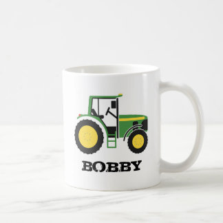 Tasse verte de tracteur avec le nom