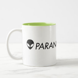 Tasse verte étrangère de Paranormalis