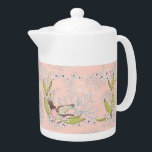 Teapot à la florale rose et conception d'oiseaux<br><div class="desc">Teapot au design floral et ornithologique rose pâle. Les fleurs sont blanches,  l'oiseau est rose avec des ailes ouvertes et il y a de beaux feuilles verts. Merci à Creative Fabrica,  et le Hungryjpeg pour certains des éléments du design.</div>