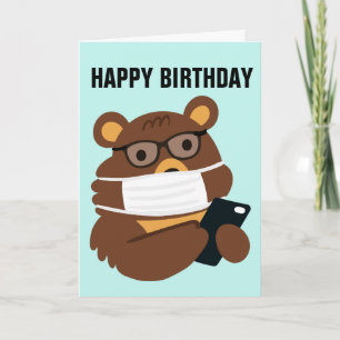 TEDDY BEAR PORTE UNE CARTE MASQUE D'ANNIVERSAIRE