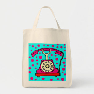 TÉLÉPHONE ROSE AVEC LE SAC FOURRE-TOUT À POINTS