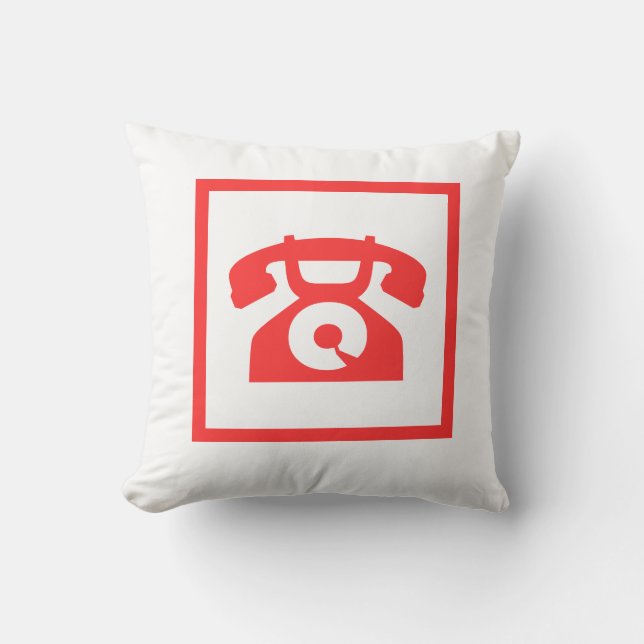 téléphone rouge rétro sur un oreiller blanc (Recto)
