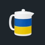 Témoin du drapeau ukrainien<br><div class="desc">Ajoutez une touche de fierté ukrainienne à votre collection de thé avec notre théière exclusive arborant le drapeau de l'Ukraine ! Réalisée avec une attention minutieuse aux détails, cette théière n’est pas seulement fonctionnelle, c’est une célébration du patrimoine ukrainien et de la fierté culturelle. Le design dynamique affiche en évidence...</div>