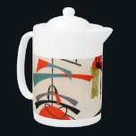 Théière atomique moderne de tissu de la moitié du<br><div class="desc">Chaque jour peut être un souffle du passé avec cette théière inspirée moderne de la moitié du siècle. Les caractéristiques de conception une reproduction d'un motif mobile atomique vintage de tissu. L'arrière - plan est ecru avec des formes bleues, oranges, vertes et noires d'art moderne. C'est la théière légère idéale...</div>