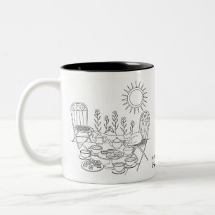 Théière de jardin avec mug chat endormi