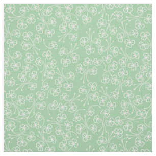 Tissu Joli blanc avec Shamrocks sur Pale Green