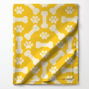 Tissu Os de chien jaunes et blancs et motif d'empreintes