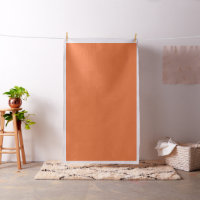 Papier cadeau avec un motif aux tons orange, r