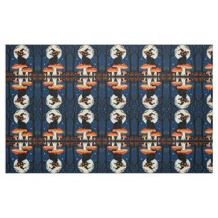 Tissu Une petite chatte noire et magique assise sur un c