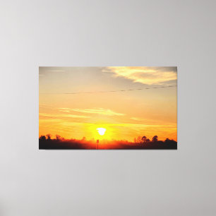 Toile Coucher de soleil doré sur des arbres en silhouett