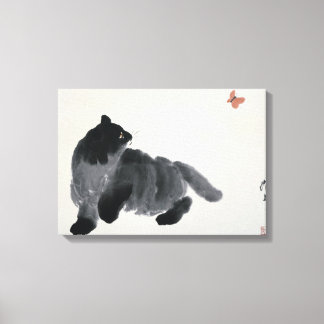 Toile de chat et papillon