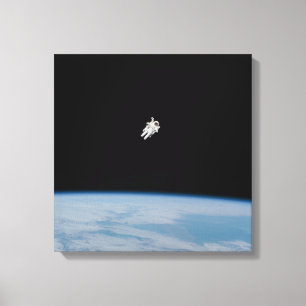 Toile L'astronaute marche au-dessus de la Terre