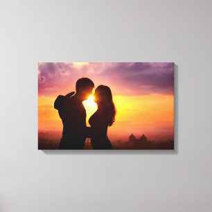 Toile Les couples silhouettent au coucher du soleil