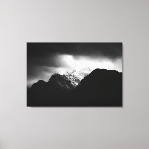 Toile Nuages orageux et soleil sur les montagnes