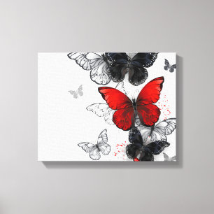 Toile Papillons noirs et rouges volants